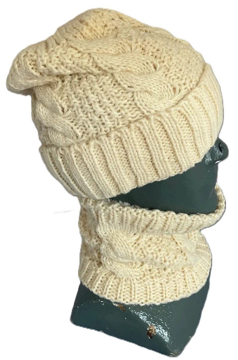 A cream-colored cable-knit beanie and matching neck warmer set displayed on a dark gray mannequin head.