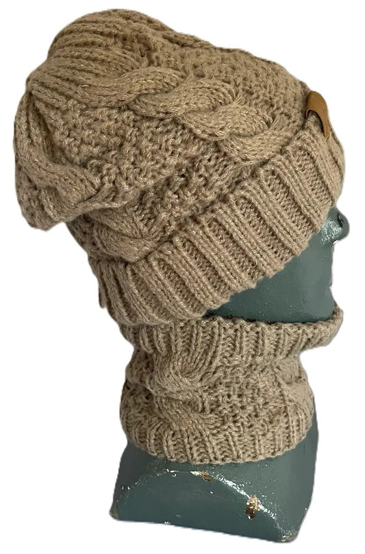 A light brown knit beanie and matching neck warmer set featuring a cable-knit pattern displayed on a mannequin head.