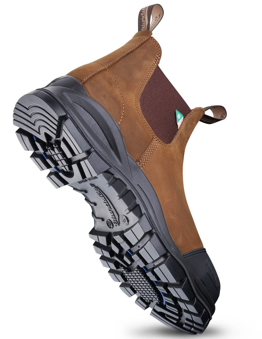 Brown work boot with a deep tread black sole and brown elastic sides, seen from the side and angled upward.