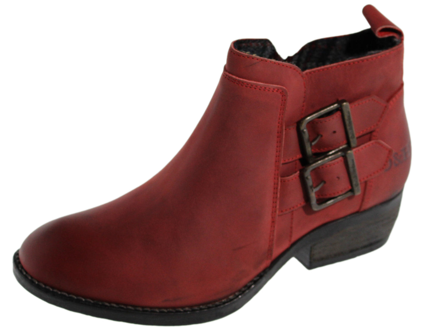 Red ankle boot with a side buckle and a low heel.