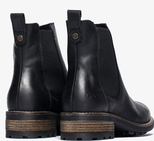 Pair of black leather Chelsea boots with elastic side panels and a block heel.