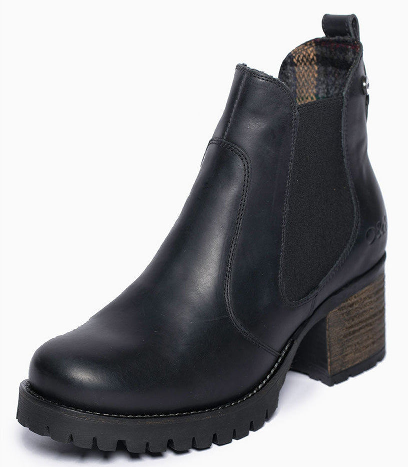 Black leather ankle boot with elastic side panels and a chunky heel and lug sole.