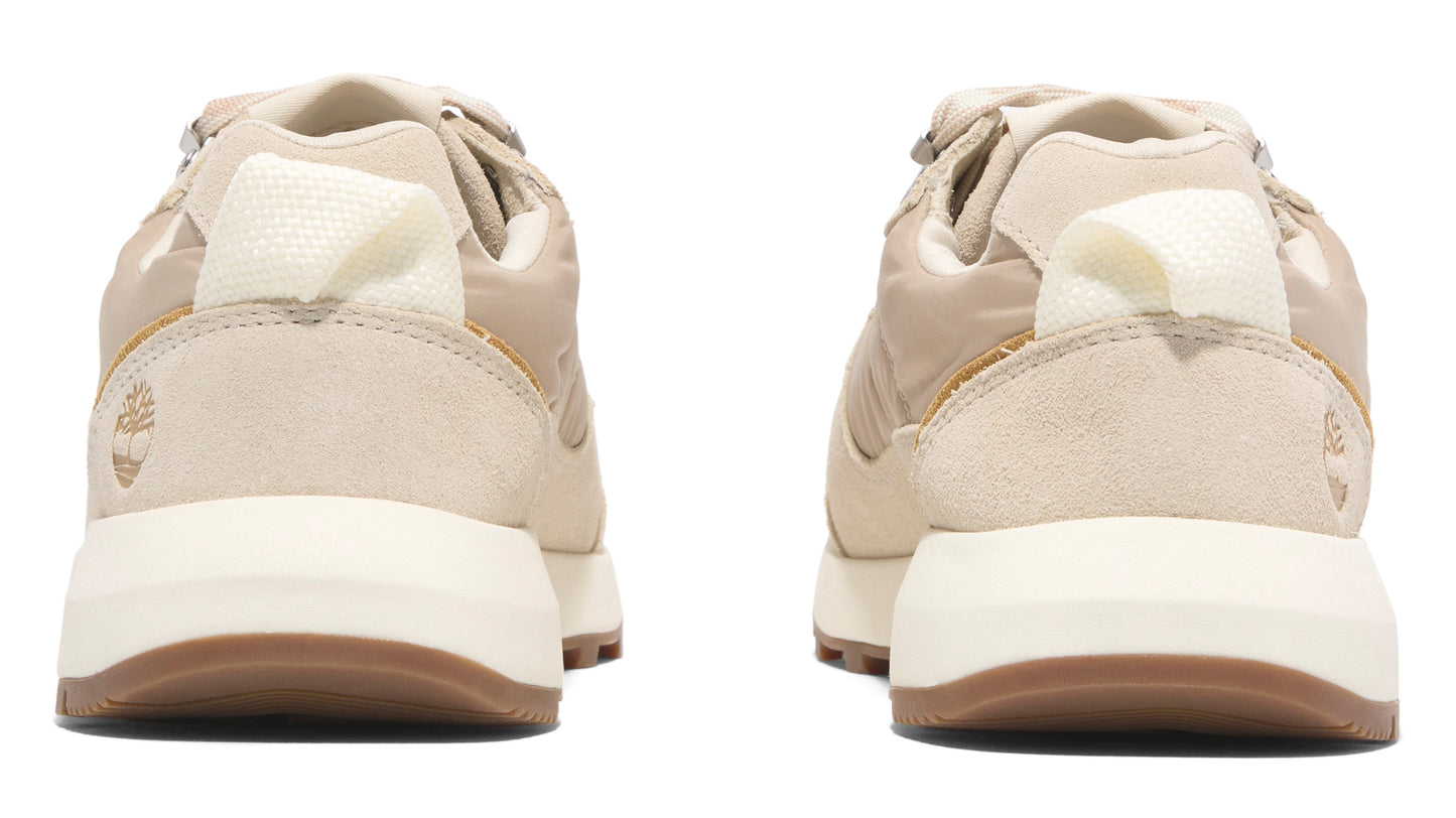 Pair of sneakers featuring beige uppers, white midsoles, and brown outsoles, rear view.