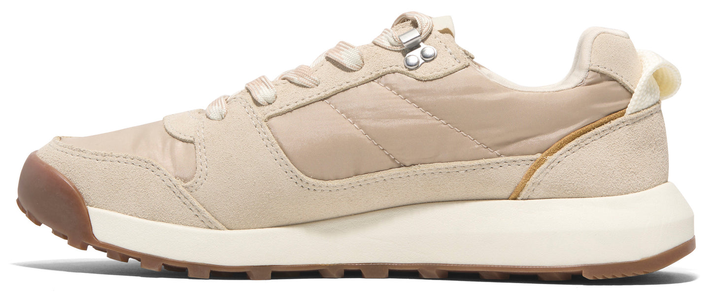 A beige athletic shoe with brown details.