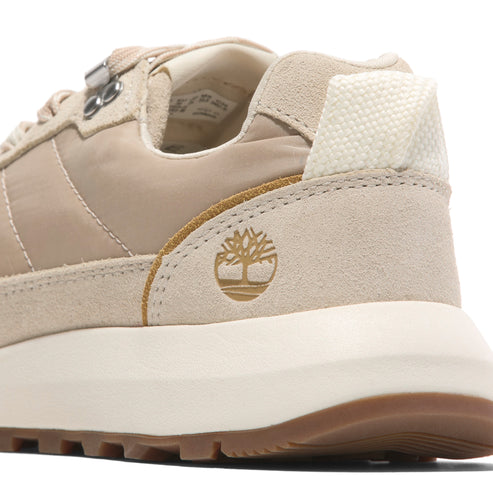 Tan-colored suede and nylon sneaker with textured white heel.