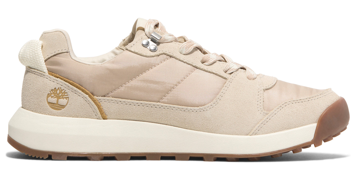 A low profile tan sneaker with white midsoles and brown outsoles.
