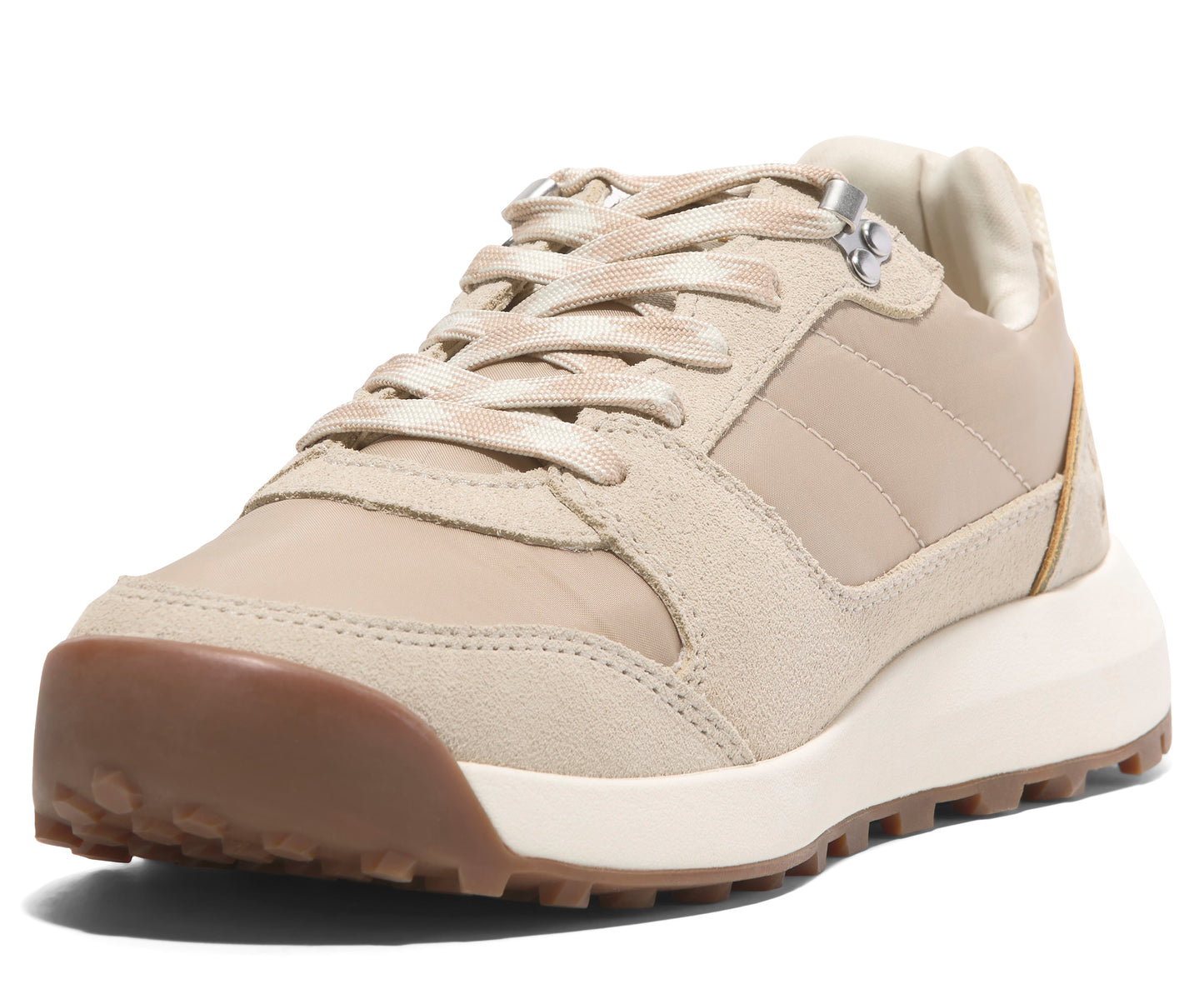 Tan-colored lace-up sneaker with brown rubber toe bumper and white midsole.