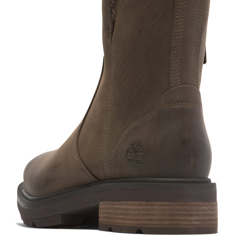 Close-up of brown, leather-like boot showing the back, block heel, and logo.