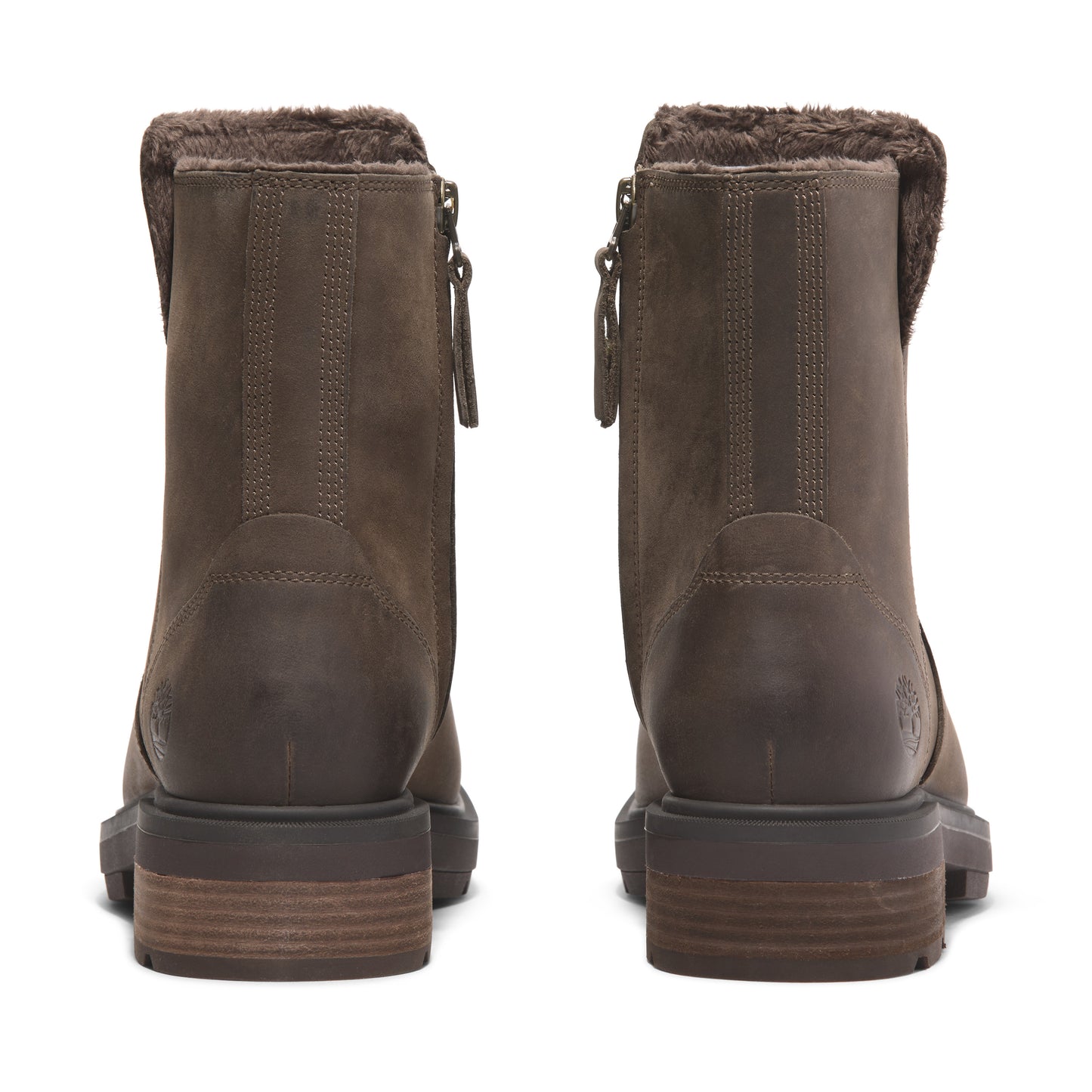 Back view of a pair of brown leather boots with a brown faux fur lining at the top.