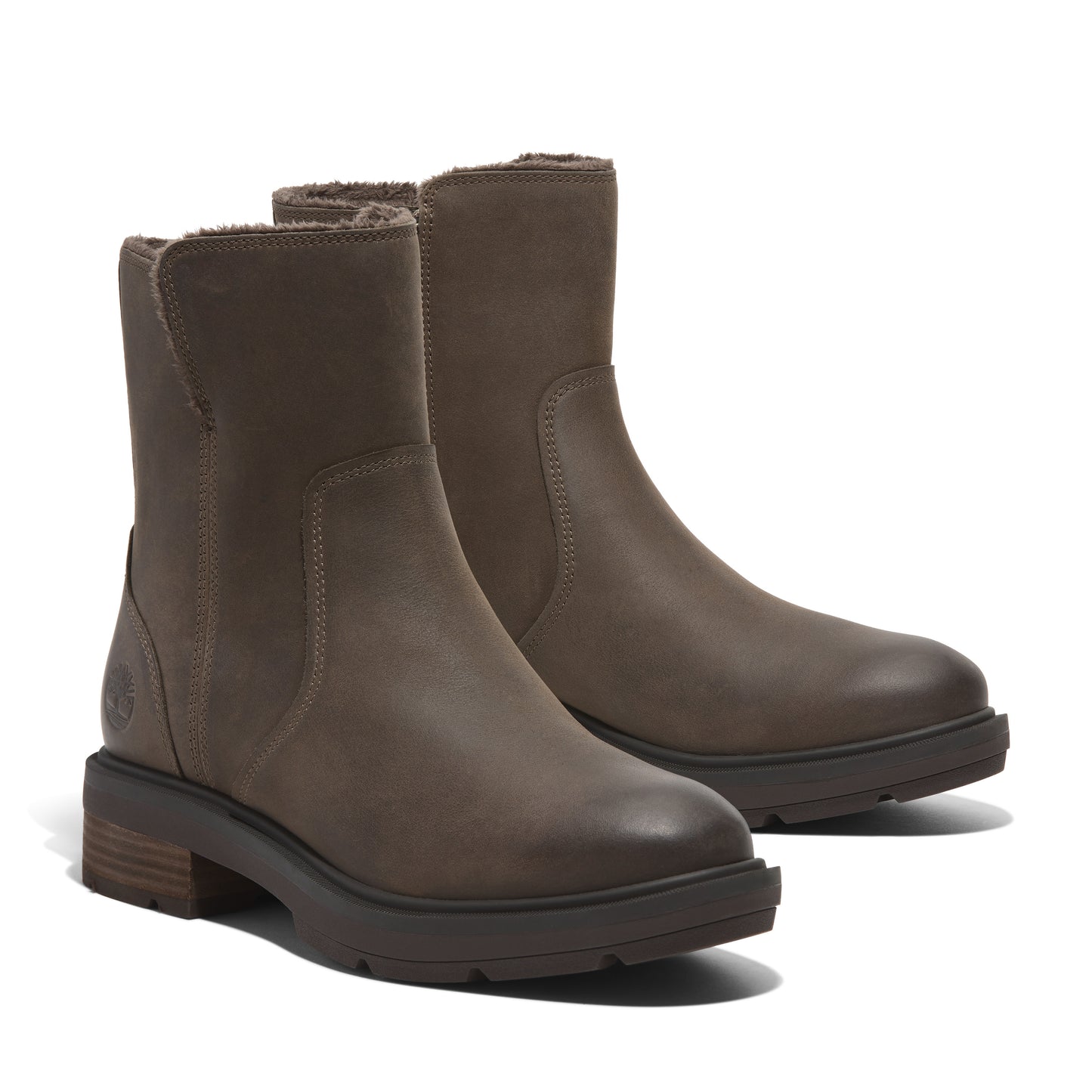 Pair of brown leather pull-on ankle boots with low stacked heels.