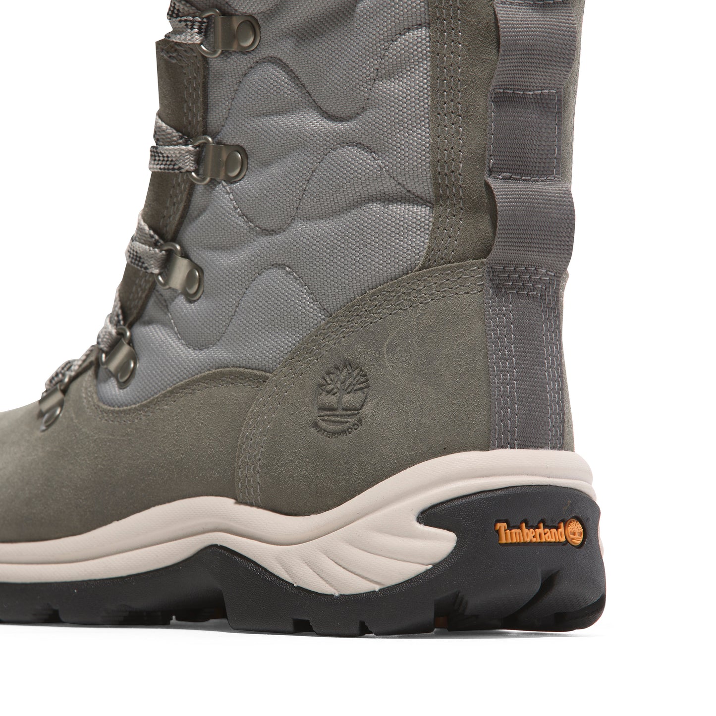 Close-up of gray waterproof boot with laces and a thick black and cream sole.