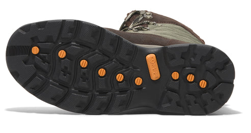 Hiking boot sole featuring a lug pattern with small round orange circles embedded in the black rubber.