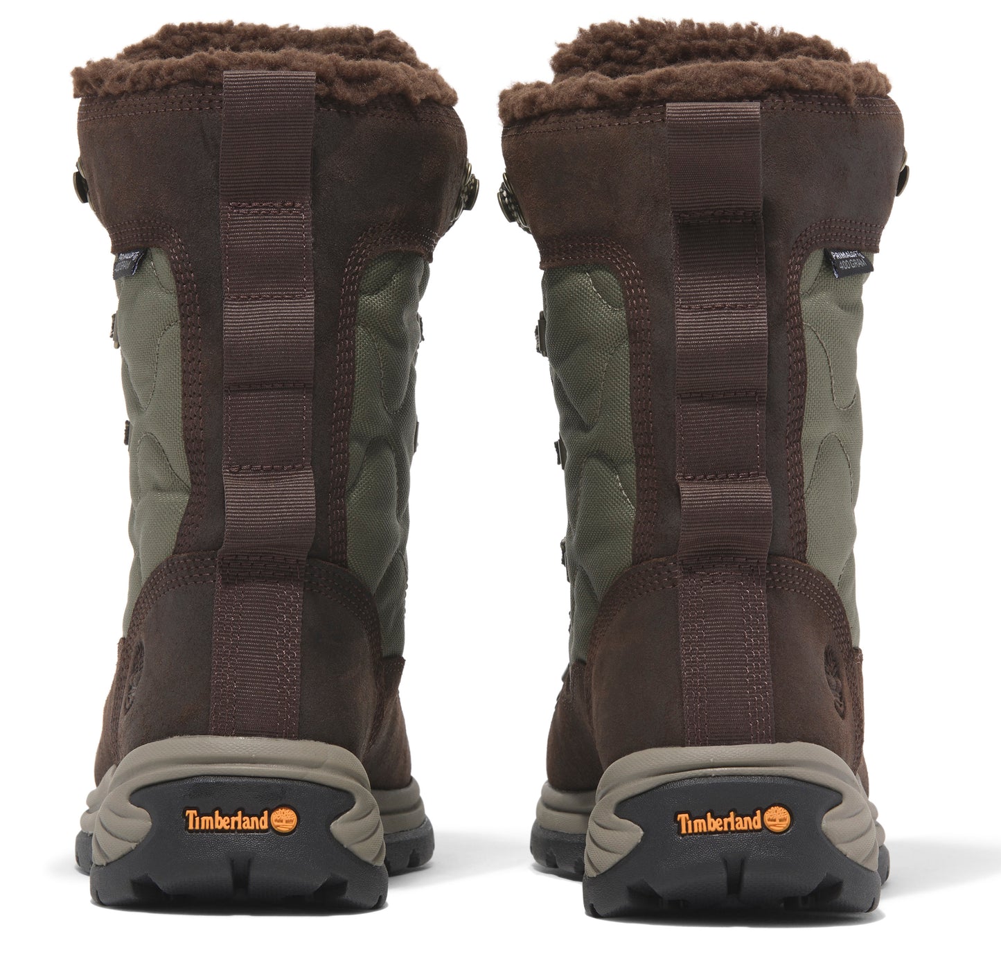 Two brown and green boots face away, revealing brown fleece lining and black soles.