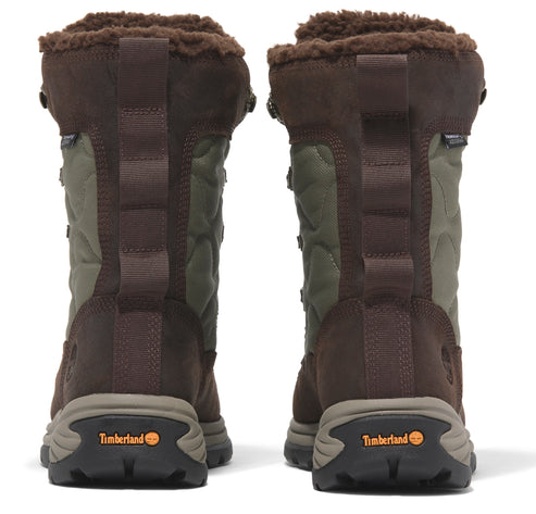 Two brown and green boots face away, revealing brown fleece lining and black soles.