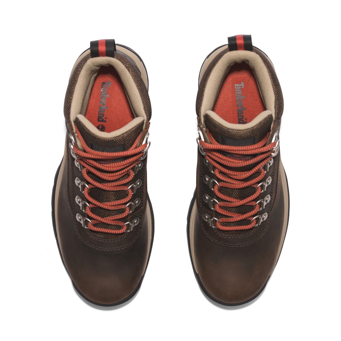 Overhead view of dark brown leather hiking boots with orange laces and a tan padded collar.