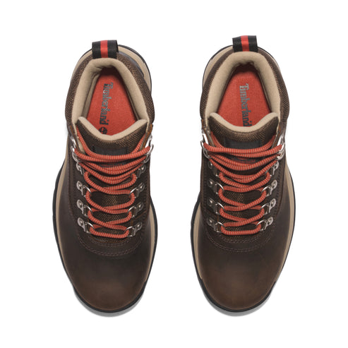 Overhead view of dark brown leather hiking boots with orange laces and a tan padded collar.