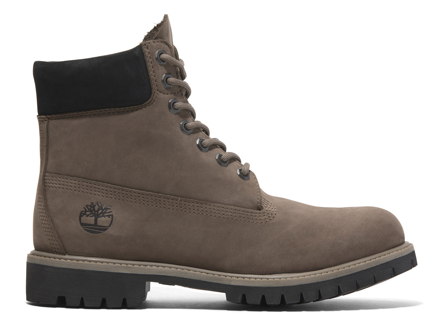 Profile view of a brown leather boot with black padded collar and dark rubber sole.
