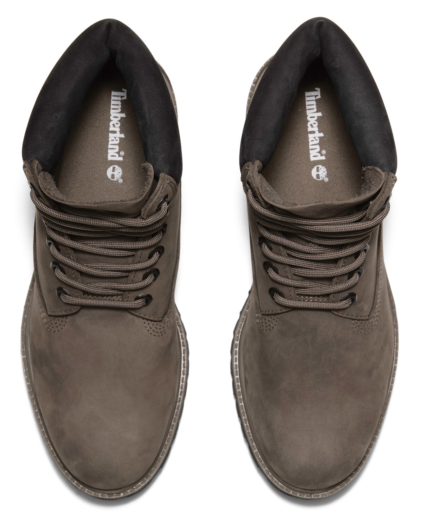 Two boots, seen from above, are identically laced with white logos visible on the inner tongue of each boot.
