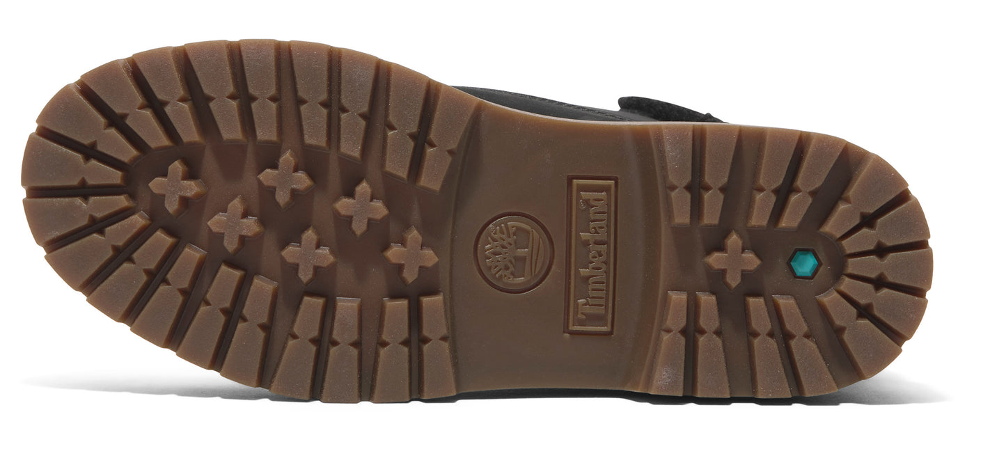 The sole of a boot features a tread with X-shaped patterns, rectangular lugs, and the text "Timberland".