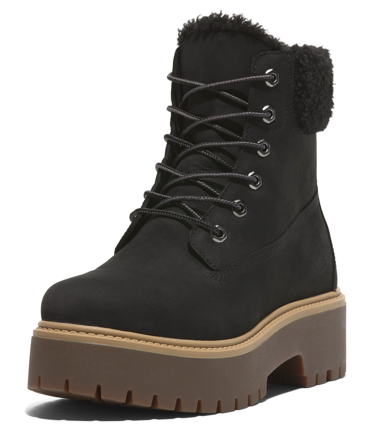 Black ankle boot with platform lug sole and fur-lined top.