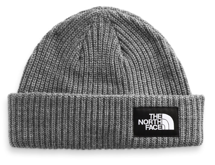 gray knit beanie with a black patch that reads "THE NORTH FACE" in white text