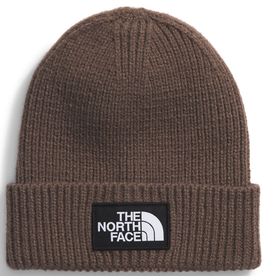 Brown ribbed beanie with a black patch that reads, THE NORTH FACE, in white font.