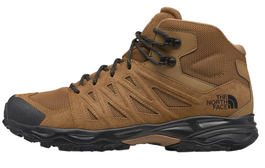 Tan mid-top hiking boot with black laces and sole, featuring the text "THE NORTH FACE" on the side.