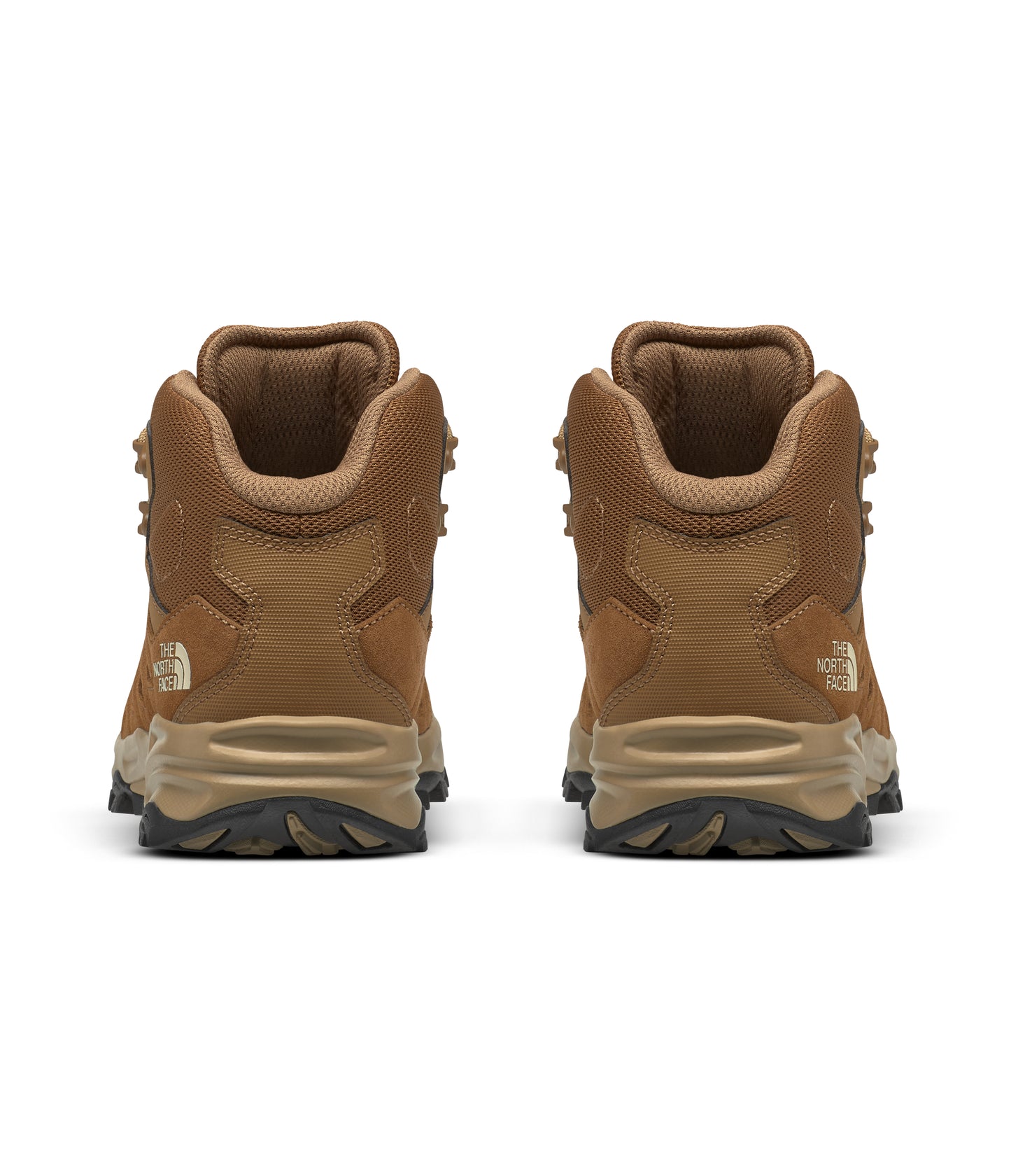 Rear view of two brown hiking boots.