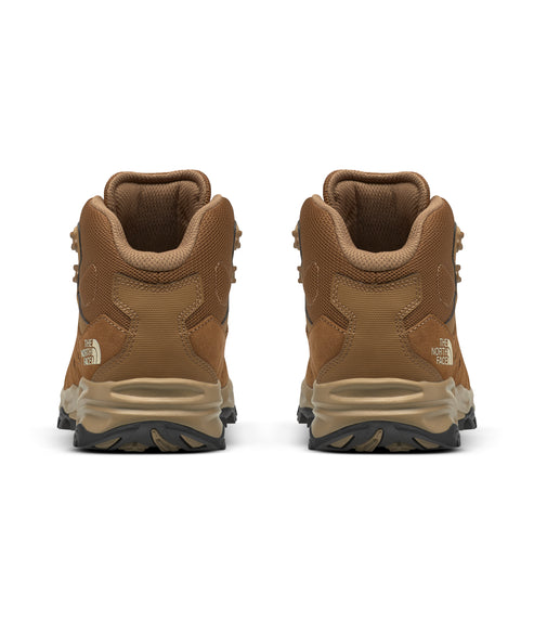 Rear view of two brown hiking boots.