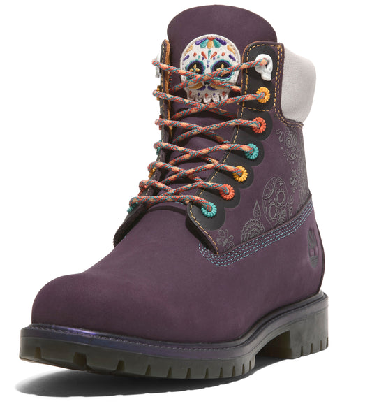 Dark purple boot with a skull on the tongue and colorful laces.