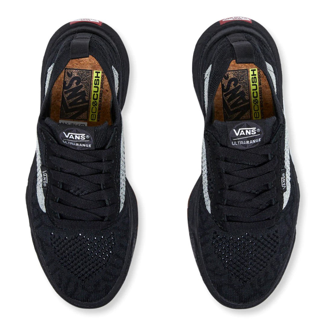 A pair of black athletic shoes with laces, visible brand text "VANS ULTRARANGE", ecocush insole, and white accents.