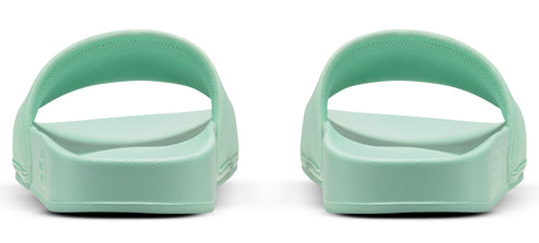 A pair of light green sandals with no straps, seen from the back.