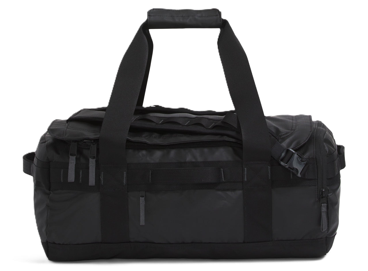 Black duffel bag with handles and straps.