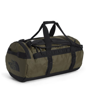 Olive duffel bag with black straps and "The North Face" printed on the side.