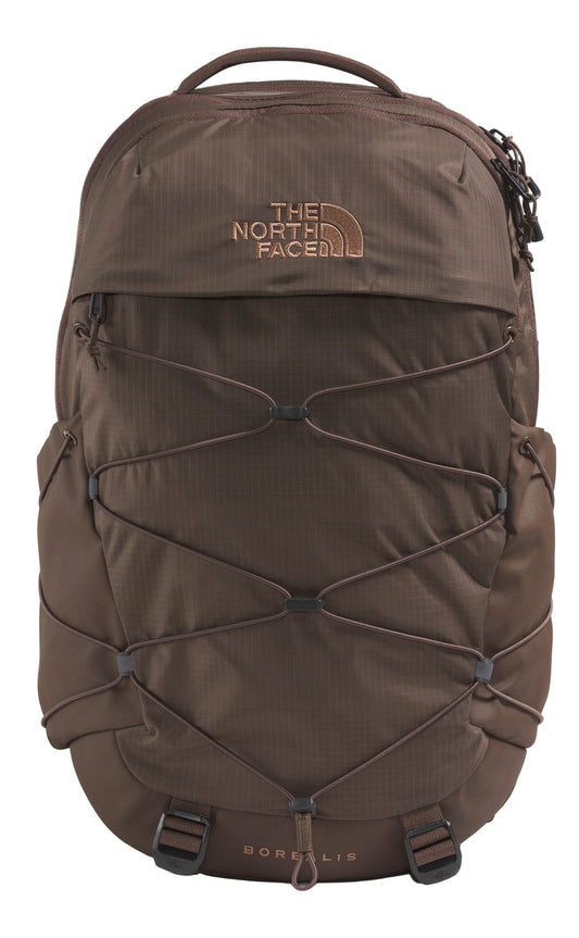 A brown backpack with a crisscross elastic cord system, visible text saying THE NORTH FACE and BOREALIS.
