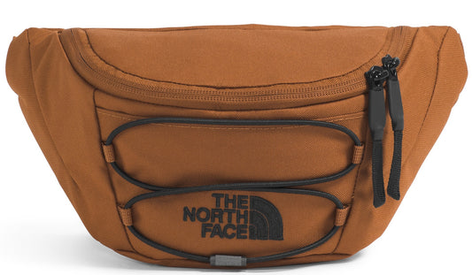 A brown waist bag with elastic cord straps, a top zipper, and a black logo that says "The North Face".