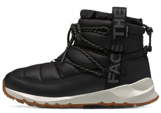 Black insulated puffy boot with laces and cream-colored sole, displaying the text "THE FACE" vertically.
