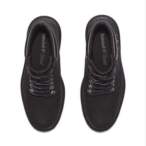 Top-down view of black ankle boots with OrthoLite insole and metal eyelets for laces.