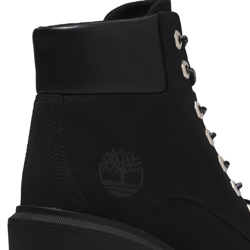 Close-up of a black boot's back with silver eyelets.