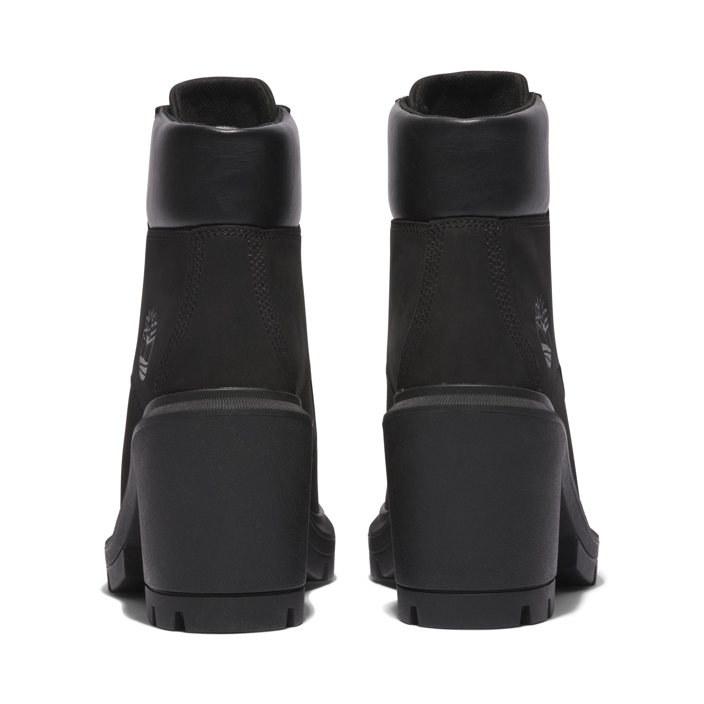 Pair of black heeled boots viewed from the back.
