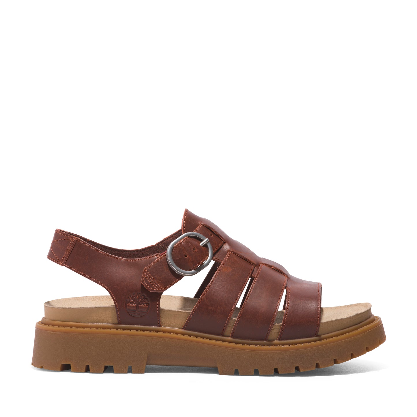 A brown leather sandal with multiple horizontal straps, an ankle strap with a silver buckle, and a thick lug sole.