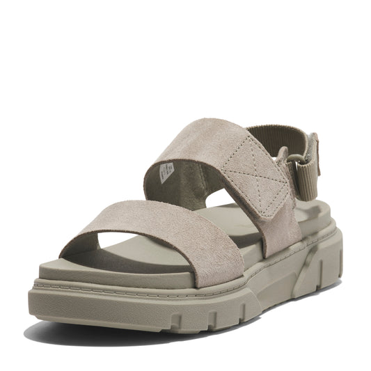 Beige suede sandal with chunky sole and velcro straps.