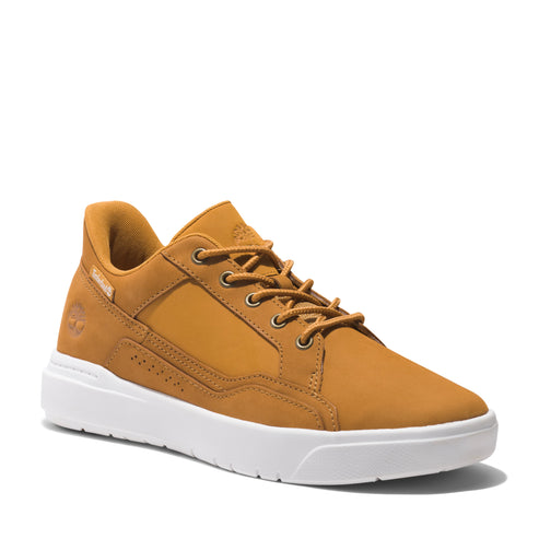 Honey colored sneaker with white soles and brown laces.