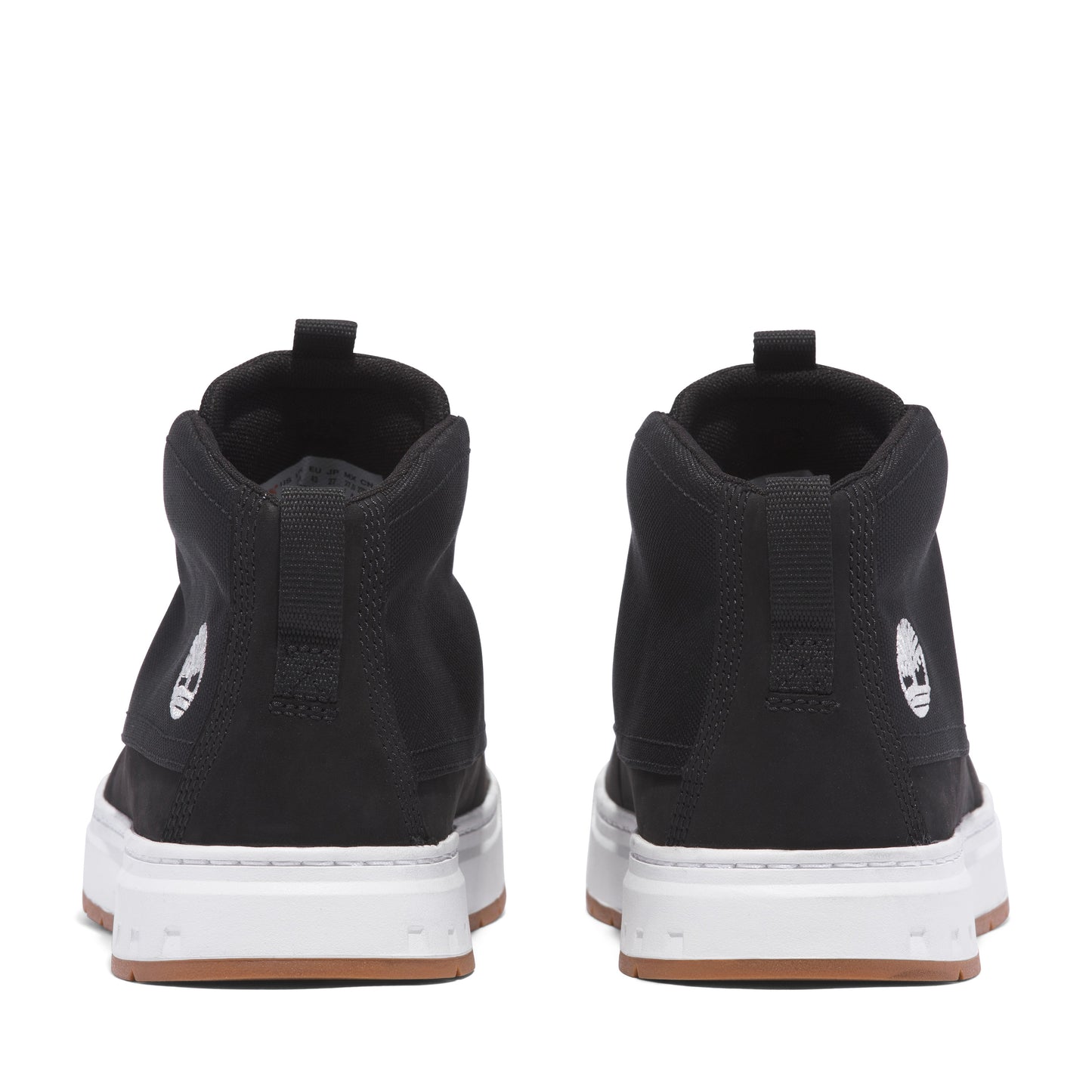 Rear view of black high top sneakers with white soles.