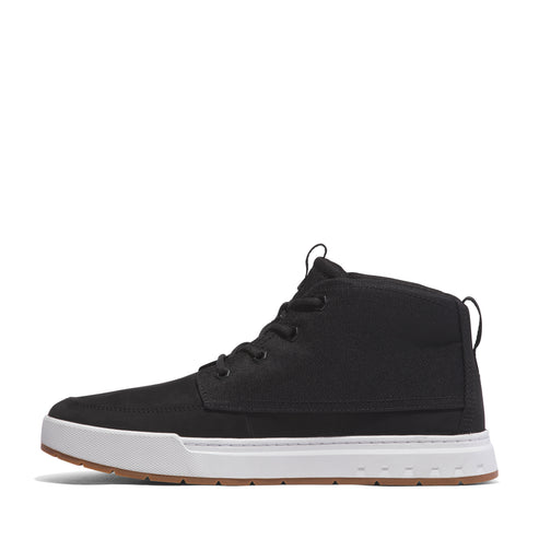 A black, high-top canvas shoe with white sole and brown tread.