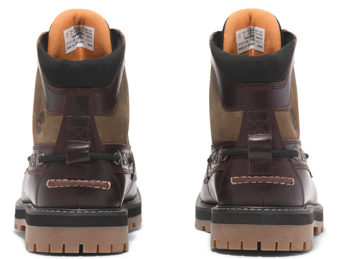 Back view of brown leather boots with a high ankle, featuring a black collar and a light brown outsole.