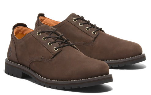 A pair of brown leather, lace-up dress shoes with a round toe and rubber sole.