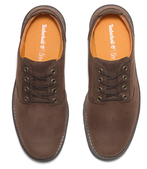 Two brown leather Timberland OrthoLite dress shoes with brown laces, top view.