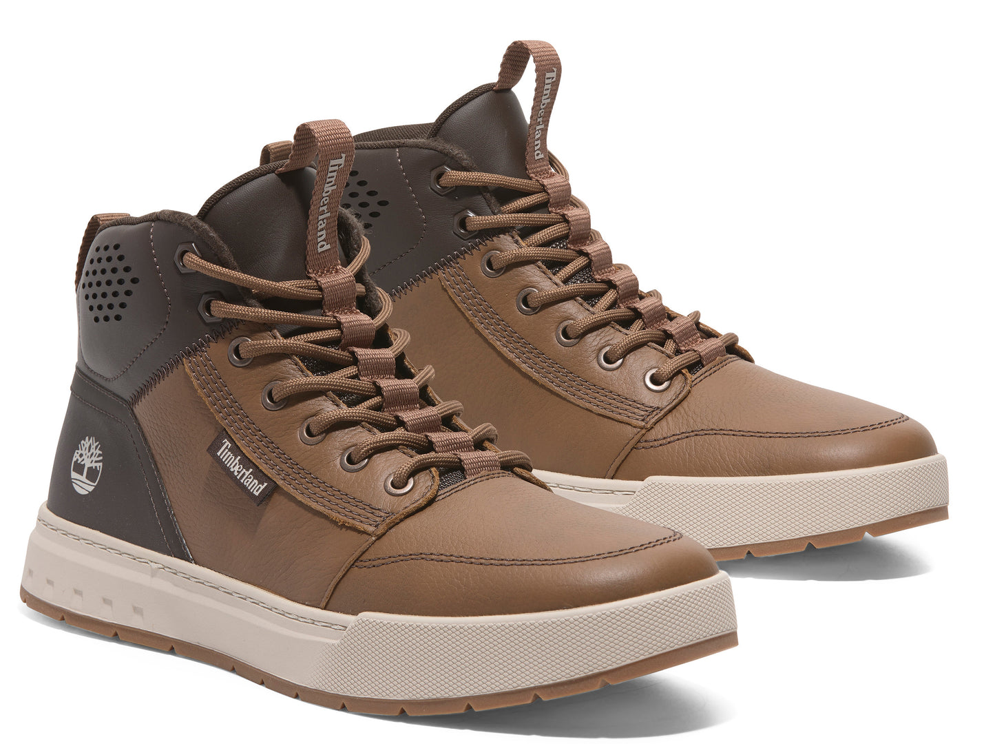 Pair of brown mid-top sneakers with light beige soles, one positioned slightly behind the other.
