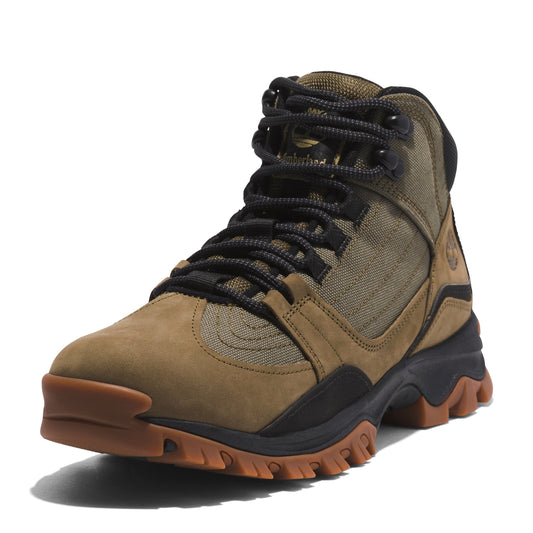 Hiking boot with brown leather toe and heel, green canvas sides, black laces, and thick treaded sole.